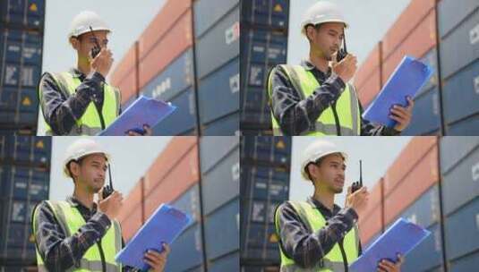 在集装箱码头工作的亚洲帅哥工程师工人。高清在线视频素材下载