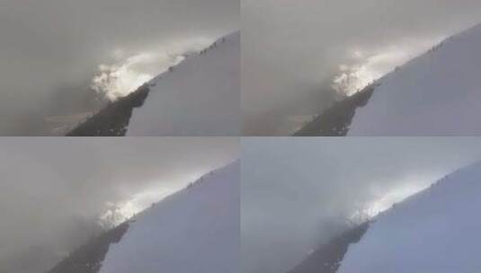 航拍攀登川西横断山脉乌库楚雪山的登山者高清在线视频素材下载