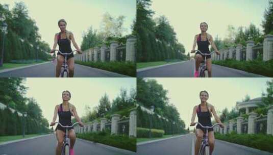 夏季公园骑自行车的女运动员。运动和积极的高清在线视频素材下载