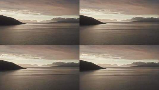 空中拍摄，爬上挪威松恩峡湾轻轻荡漾的水面高清在线视频素材下载