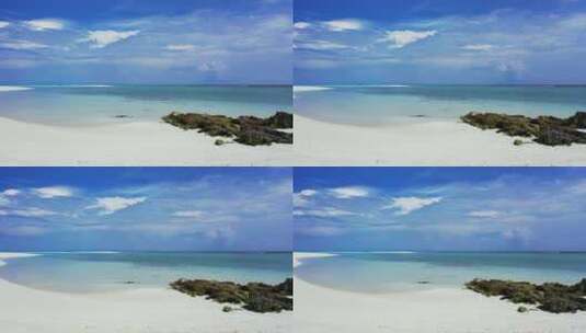 白天，白色天堂海滩和蓝色水域背景的抽象照片，色彩缤纷4K高清在线视频素材下载