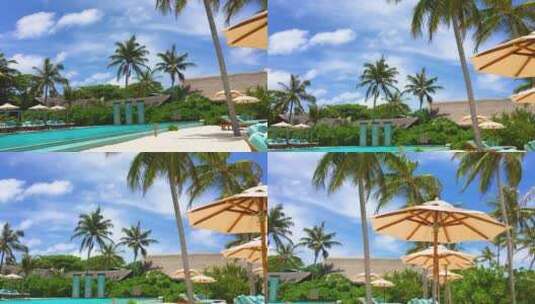 晴天马尔代夫大海、沙滩、泳池、沙滩椅高清在线视频素材下载