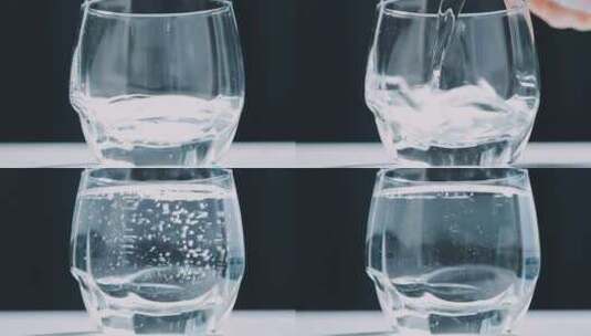 玻璃杯倒水/装满水的玻璃杯高清在线视频素材下载