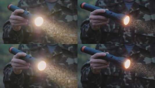 士兵拿着手电筒照明高清在线视频素材下载