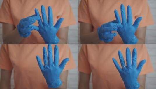 往戴蓝色手套的手上戴戒指高清在线视频素材下载