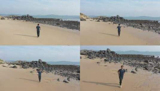 航拍福建平潭海边的沙滩人在奔跑高清在线视频素材下载