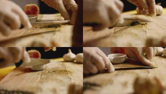 厨师在木板上准备切碎的绿色香草和大蒜高清在线视频素材下载