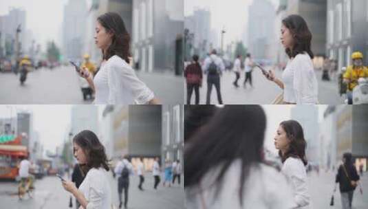 美女成都街头漫步看手机的都市白领高清在线视频素材下载