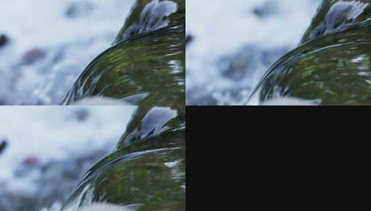 清澈的溪水在岩石上流过高清在线视频素材下载