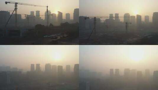 日出雾霾中的工地和远处的高楼高清在线视频素材下载