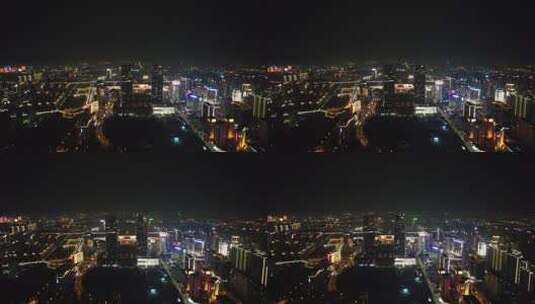 河南郑州绿地双子塔地标建筑夜景航拍高清在线视频素材下载