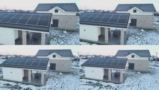 冬季小露台房屋屋顶上的太阳能电池板。冬季高清在线视频素材下载