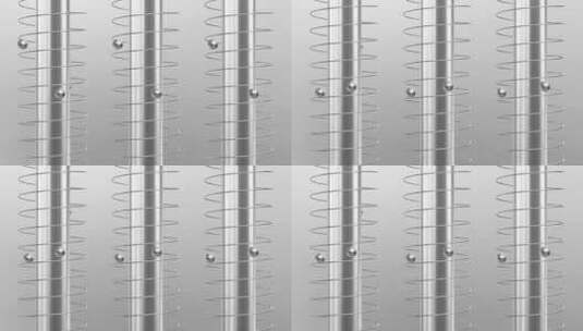 磁性线圈组上的浮动金属珠高清在线视频素材下载