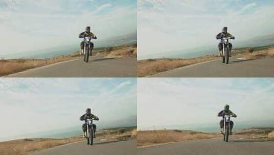 男人站立骑行摩托车高清在线视频素材下载