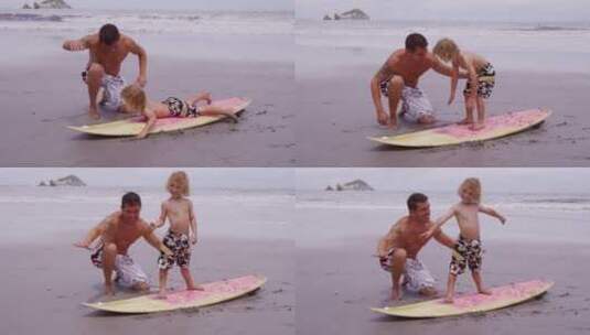 父亲在沙滩上教孩子冲浪高清在线视频素材下载