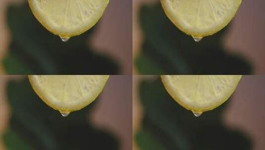 从新鲜柠檬片上滴落的水滴高清在线视频素材下载