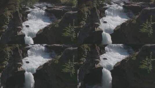 岩石中流动的瀑布高清在线视频素材下载