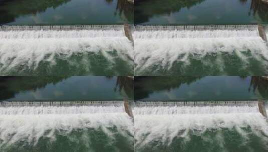 航拍江流堤坝流水瀑布高清在线视频素材下载