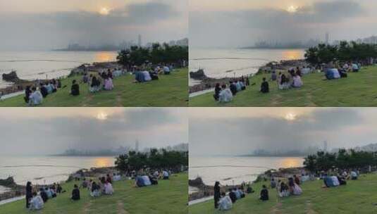 旅游景区，青岛小麦岛草地看夕阳高清在线视频素材下载