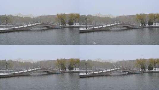 冬天大雪，行人打伞走过石桥高清在线视频素材下载