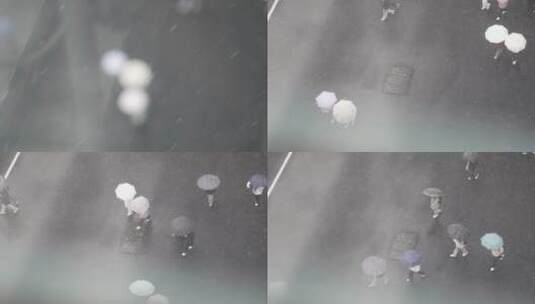 趴栏杆下雪天俯瞰撑伞路人（无露脸）高清在线视频素材下载