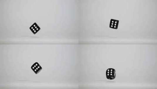 一颗黑色的骰子掉落转动特写高清在线视频素材下载