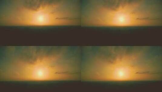 黄色天空中的日落。延时。明亮的黄色大太阳落下。令人敬畏的天空景观和高清在线视频素材下载