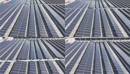 航拍工厂厂房屋顶的分布式太阳能光伏发电站高清在线视频素材下载
