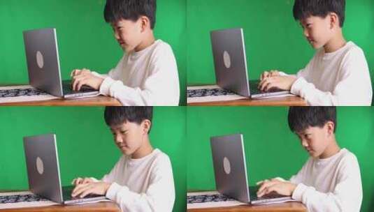 可爱的中国小男孩使用笔记本电脑8K实拍高清在线视频素材下载