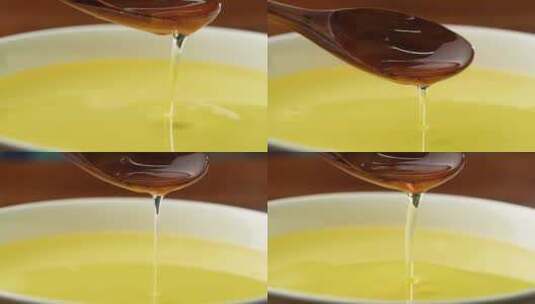 油滴落茶汤食用油金色液体实拍高清在线视频素材下载