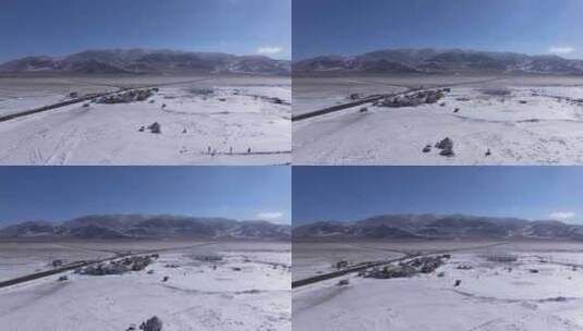 航拍新疆冬季赛里木湖冰封湖面雪山冰湖雪景高清在线视频素材下载