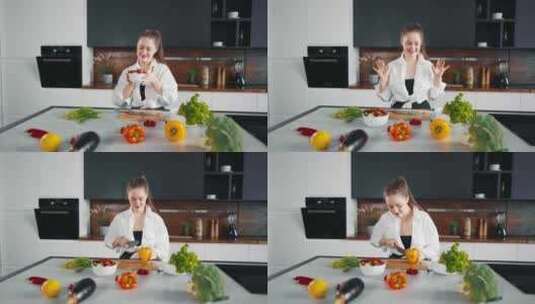 年轻女子在厨房做饭跳舞女孩做饭用耳机听音高清在线视频素材下载