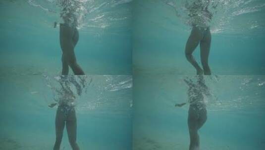 女人在海里行走水下拍摄高清在线视频素材下载