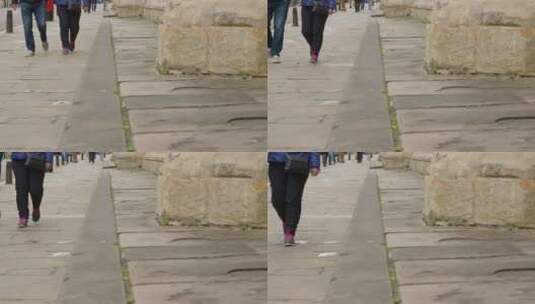 行人走在人行道上的长镜头高清在线视频素材下载