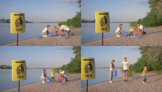 一家人在清理海滩垃圾高清在线视频素材下载