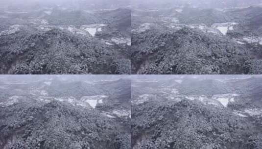航拍大雪中的群山和村庄高清在线视频素材下载