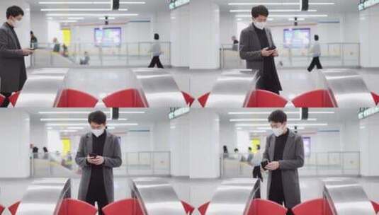商务人士戴口罩在地铁站使用手机刷手机进入高清在线视频素材下载