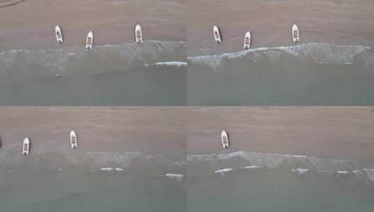 俯拍海边沙滩海浪游船高清在线视频素材下载