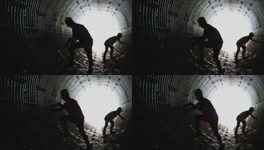 两个工人在洞里做焊接高清在线视频素材下载