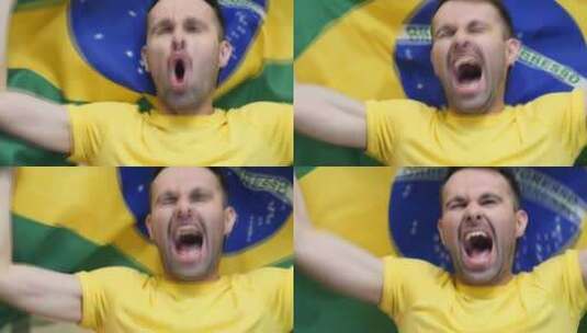 巴西球迷手持巴西国旗庆祝高清在线视频素材下载