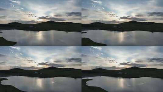 航拍绿色山谷湖泊暮色高清在线视频素材下载