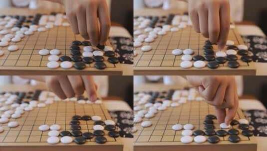 可爱的男孩在窗边下围棋高清在线视频素材下载