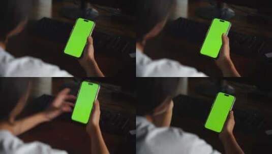 人物看手机绿屏抠像手机绿屏幕苹果手机绿幕高清在线视频素材下载