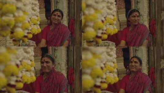 印度女人开心地触摸桂花装饰高清在线视频素材下载