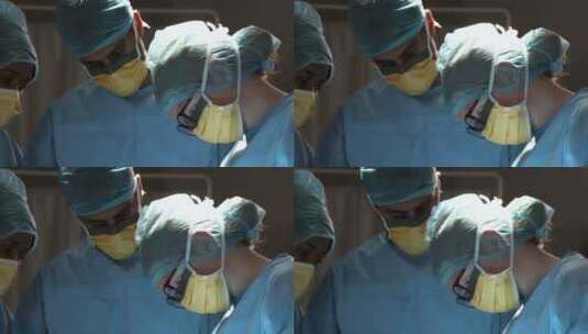三个外科医生低头做手术高清在线视频素材下载