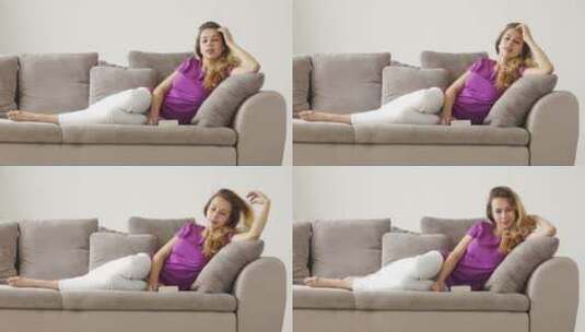 女孩躺在沙发上高清在线视频素材下载