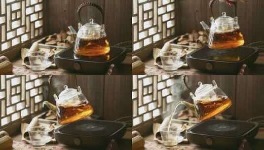 将养生壶中的陈皮茶倒入杯中高清在线视频素材下载