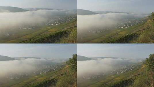 雾笼罩着山谷和村庄。高清在线视频素材下载