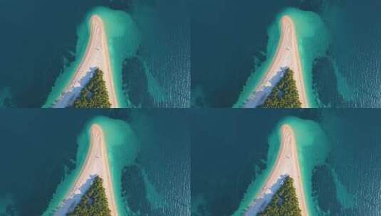 无人驾驶飞机飞越沿海地带、树木和岸上度假小镇克罗地亚的海滩高清在线视频素材下载