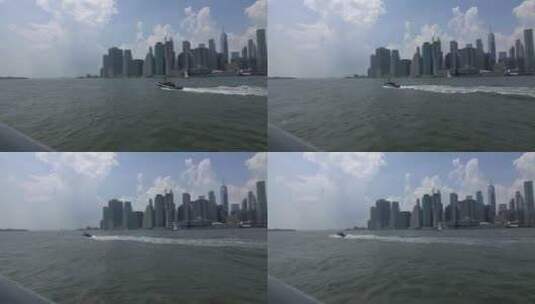 曼哈顿的城市景观，白天有船只穿越。高清在线视频素材下载